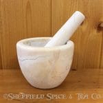 beige marble mortar and pestle