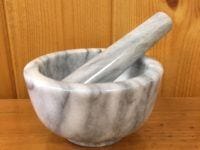 small white marble mortar and pestle