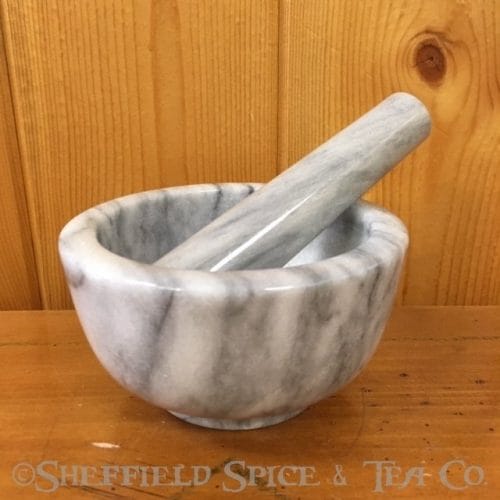 small white marble mortar and pestle