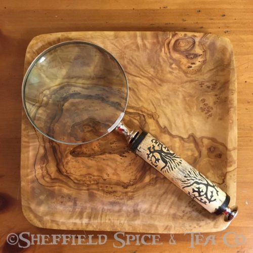 magnifying glass carved wood