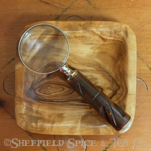 magnifying glass small brown carved wood